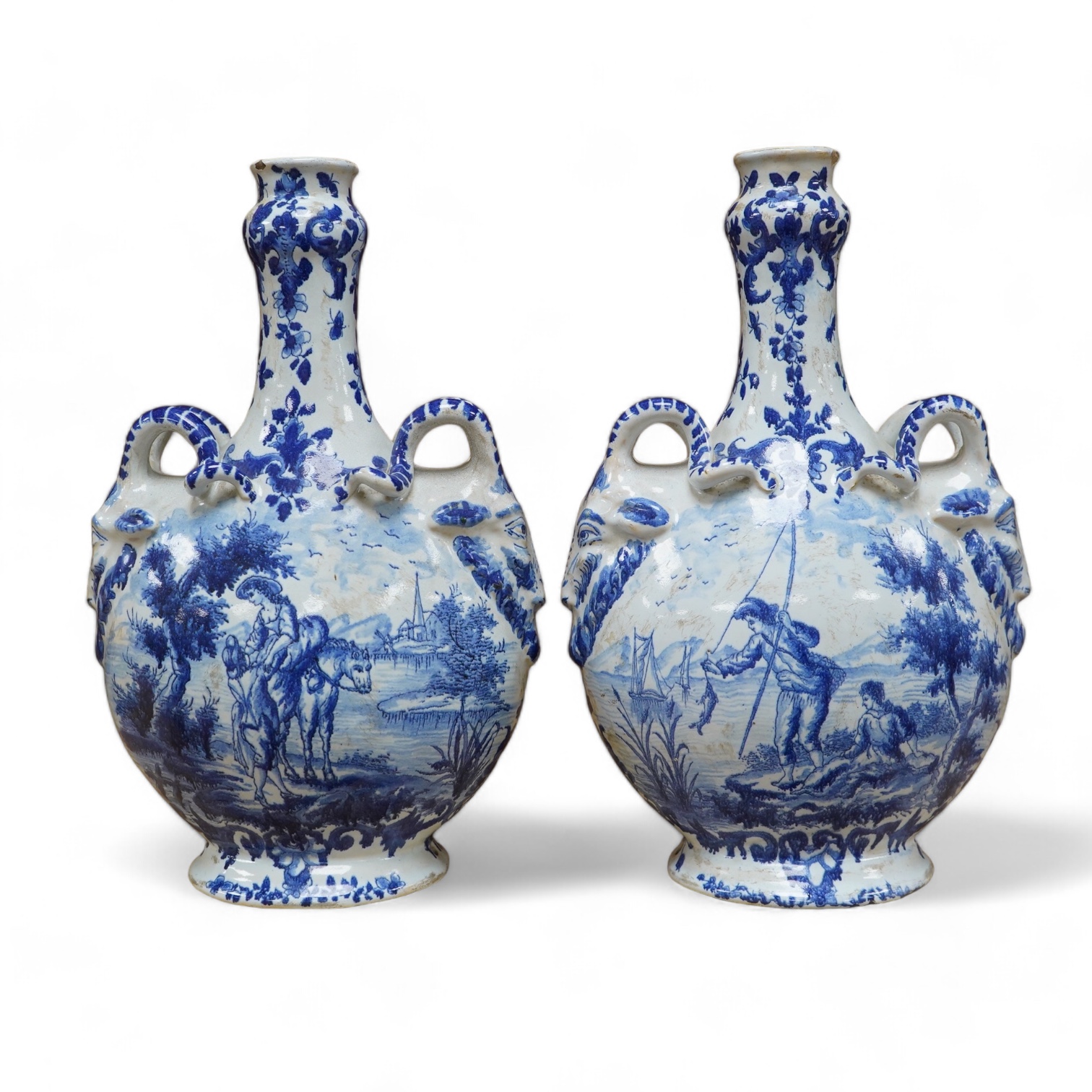 A pair of mid 18th century Delft blue and white flagons
